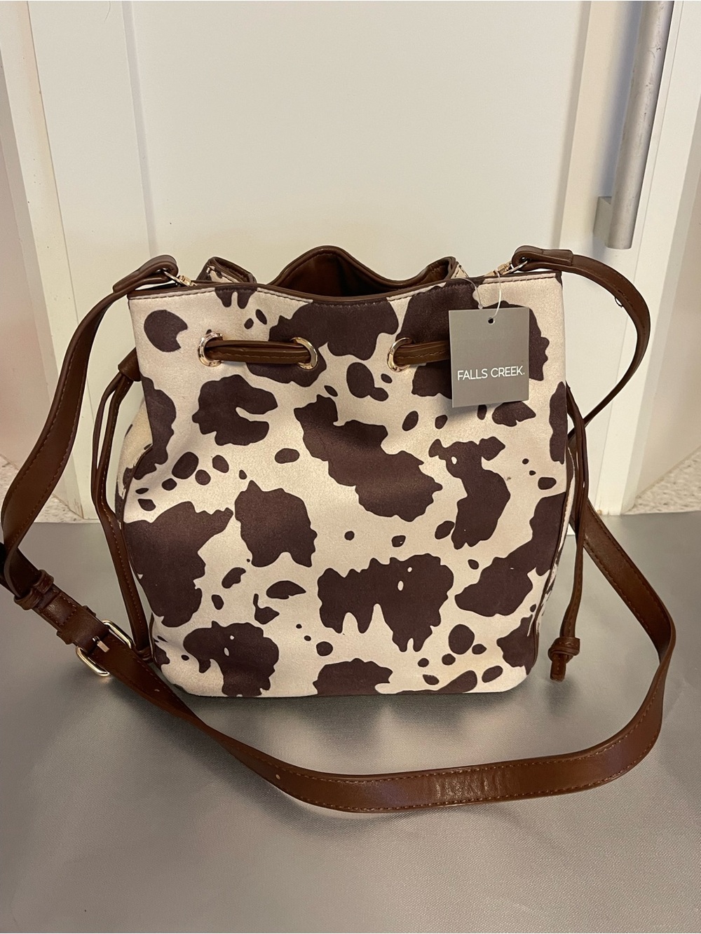 Falls Creek Women’s Brown & Cream Cowhide Print Bucket Bag w/Drawstring Closure